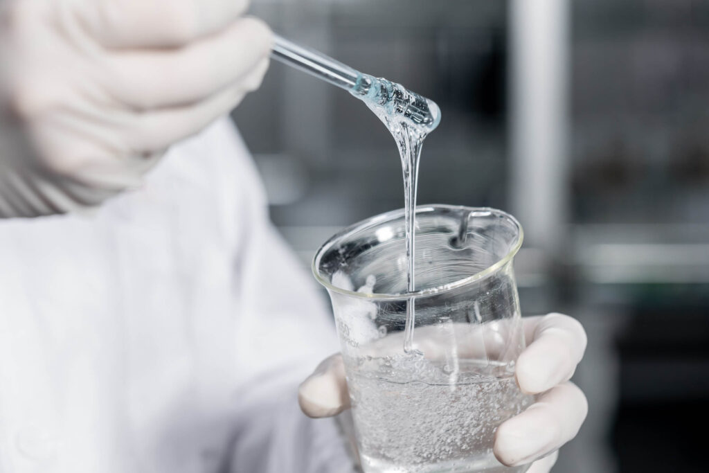 Personnel in the laboratory are mixing industrial glue, wearing for industrial chemicals UK